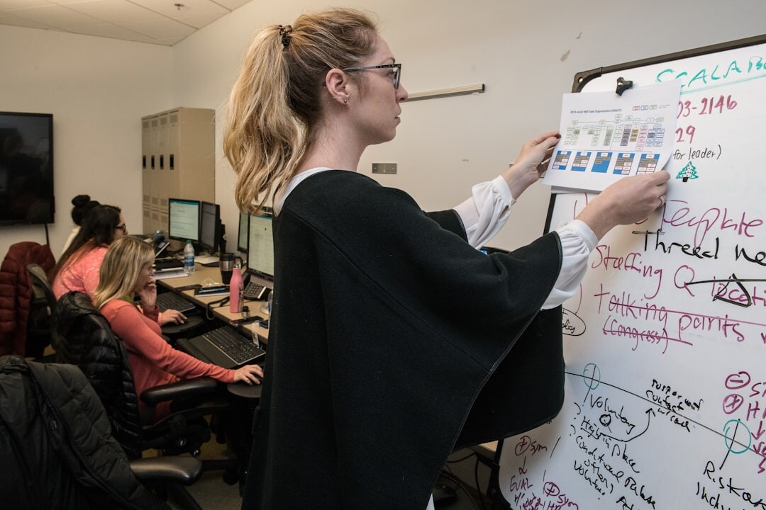Editorial team planning coverage on a whiteboard calendar