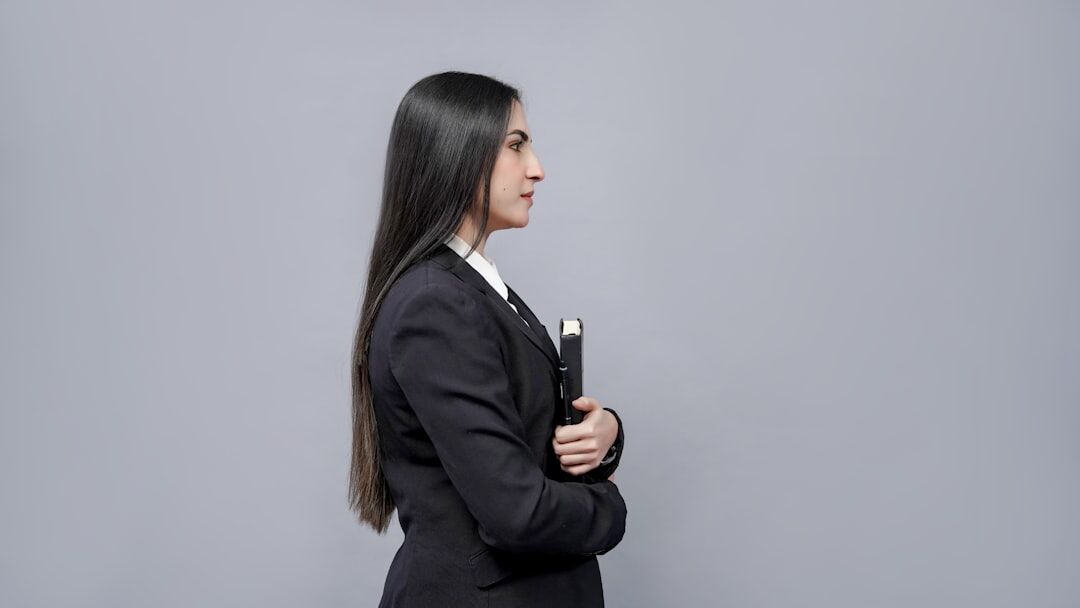 Studio portrait of a female journalist holding a microphone