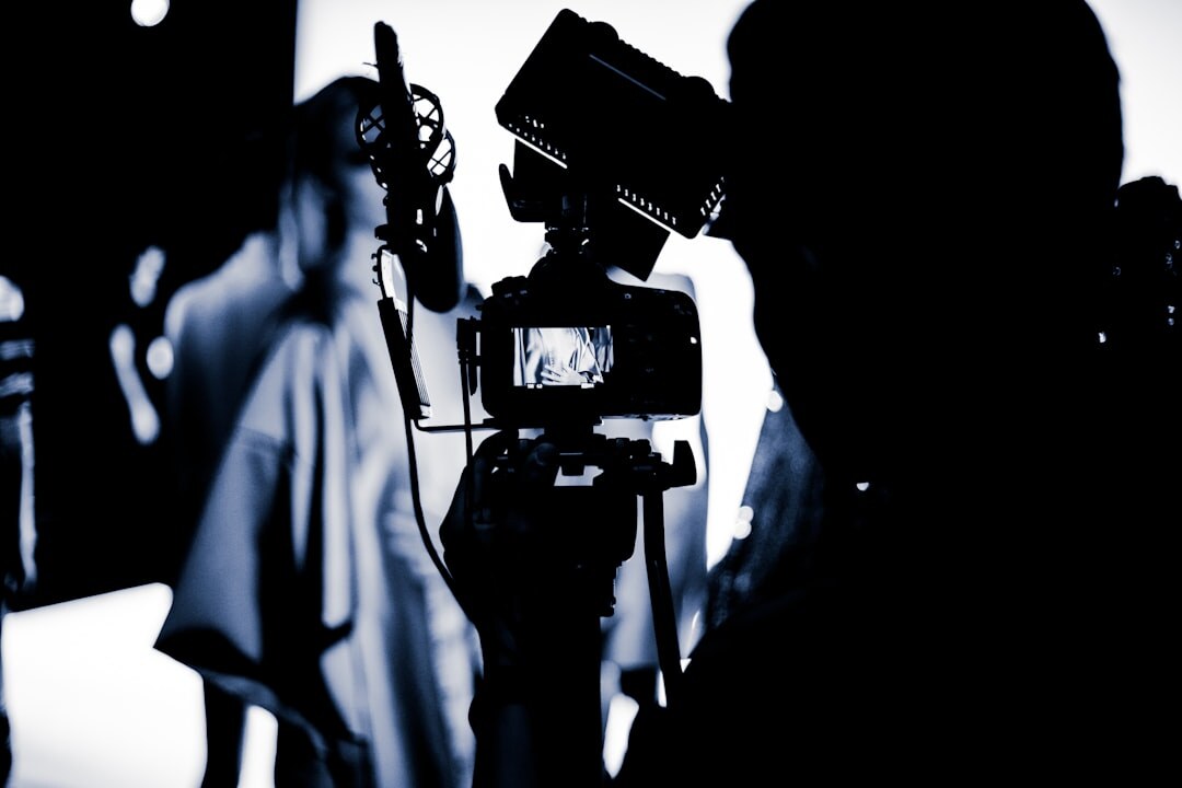 Camera operator filming a press conference