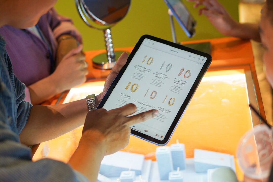 Editorial team reviewing an assignment planning calendar on a tablet